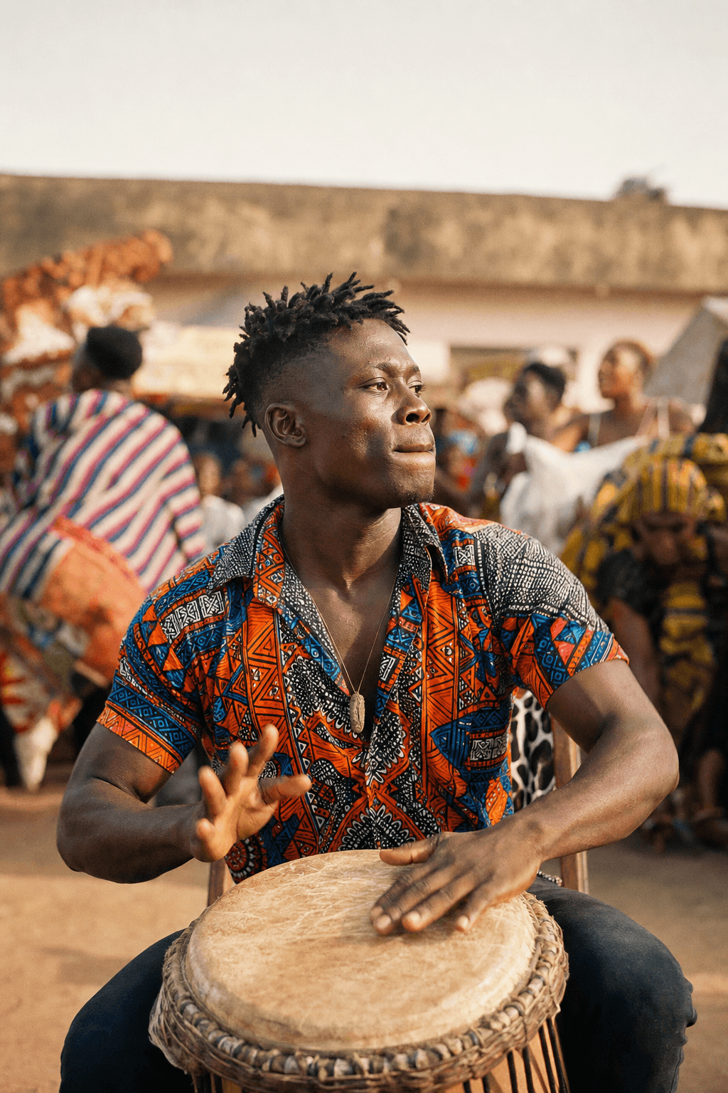 A Ghanaian drummer performing at a community gathering